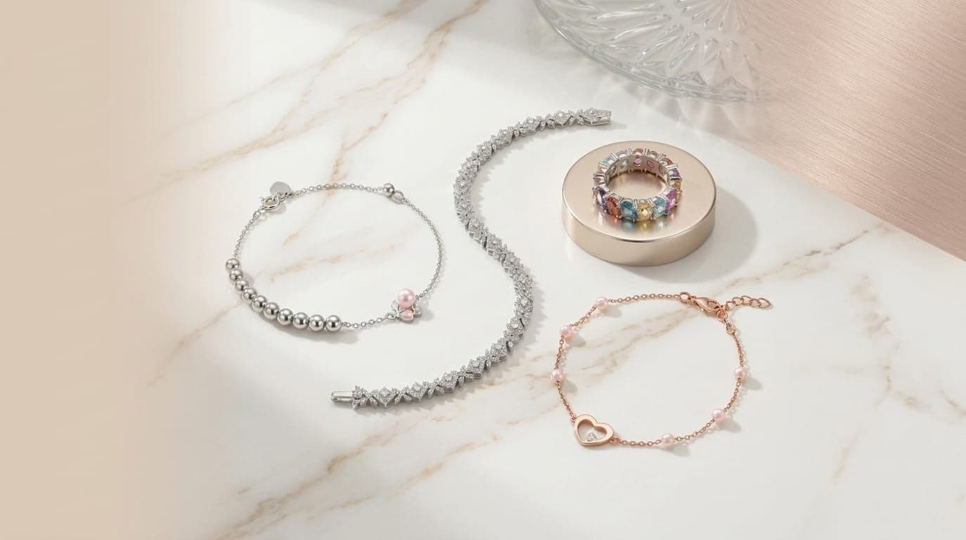 Accessory banner with bracelets, a ring, and soft marble surface styling.
