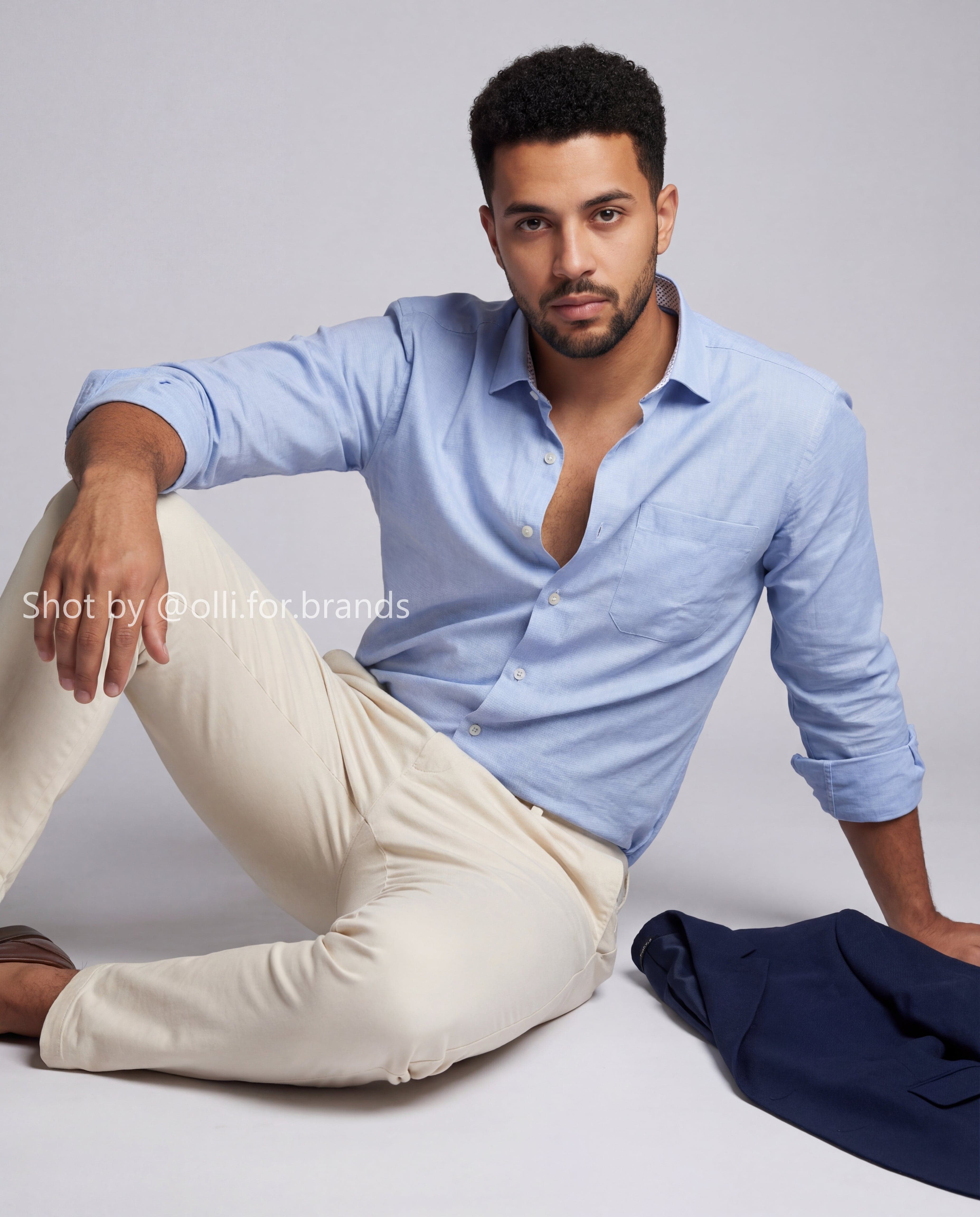 Light Blue Shirt Seated Look men's wear lookbook image.
